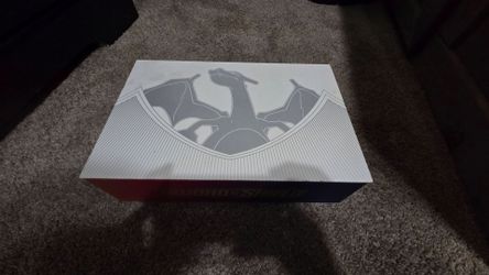 Charizard Pokémon box with cards.