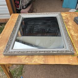  pretty mirror its 28 inches tall and 23 inches wide 
