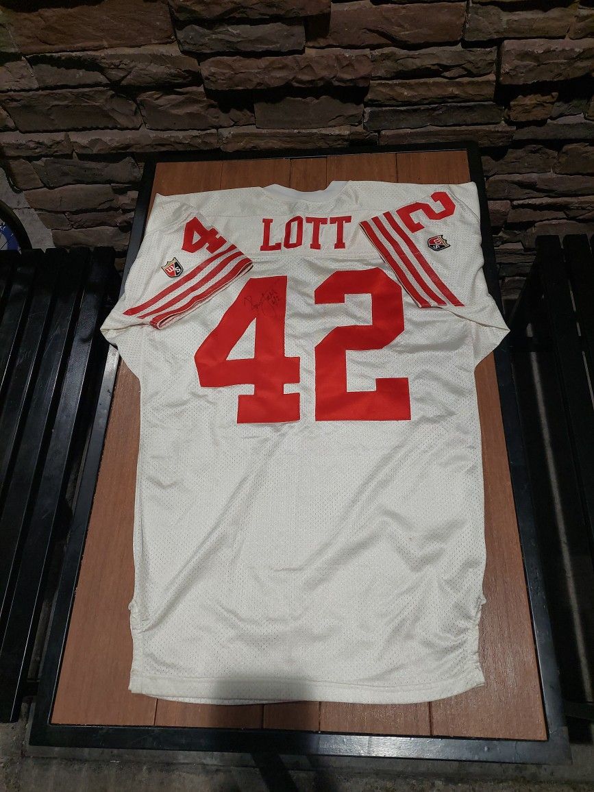 Autographed Ronnie Lott Jersey by WILSON
