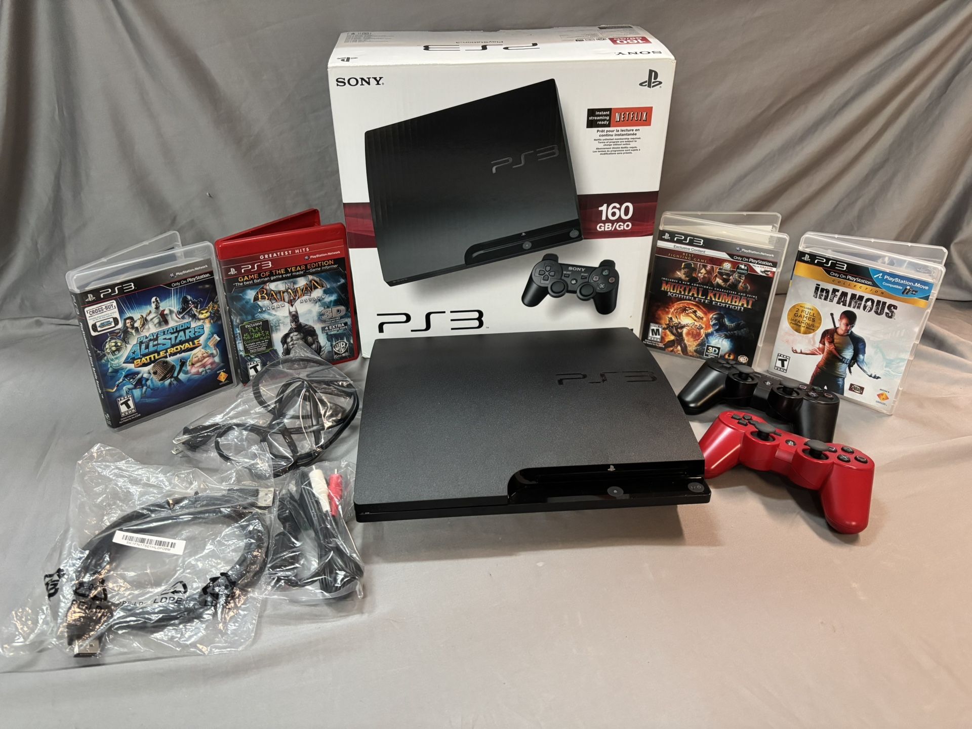 PlayStation 3 (PS3) lightly used 1 standard controller 1 red controller 1 HDMI cable 1 AV cable