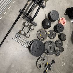 Weight Plates, Dumbbells, Bench And Cage, And Dip Station