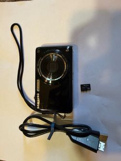The Samsung ST600 Touch Screen Digital Camera is a sleek and compact device with a 14.2 MP maximum resolution and a 5x optical zoom lens, perfect for 