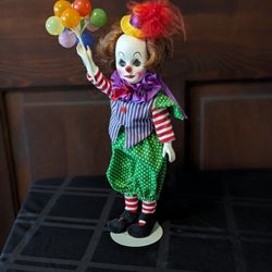 Clarence the Clown doll with doll stand