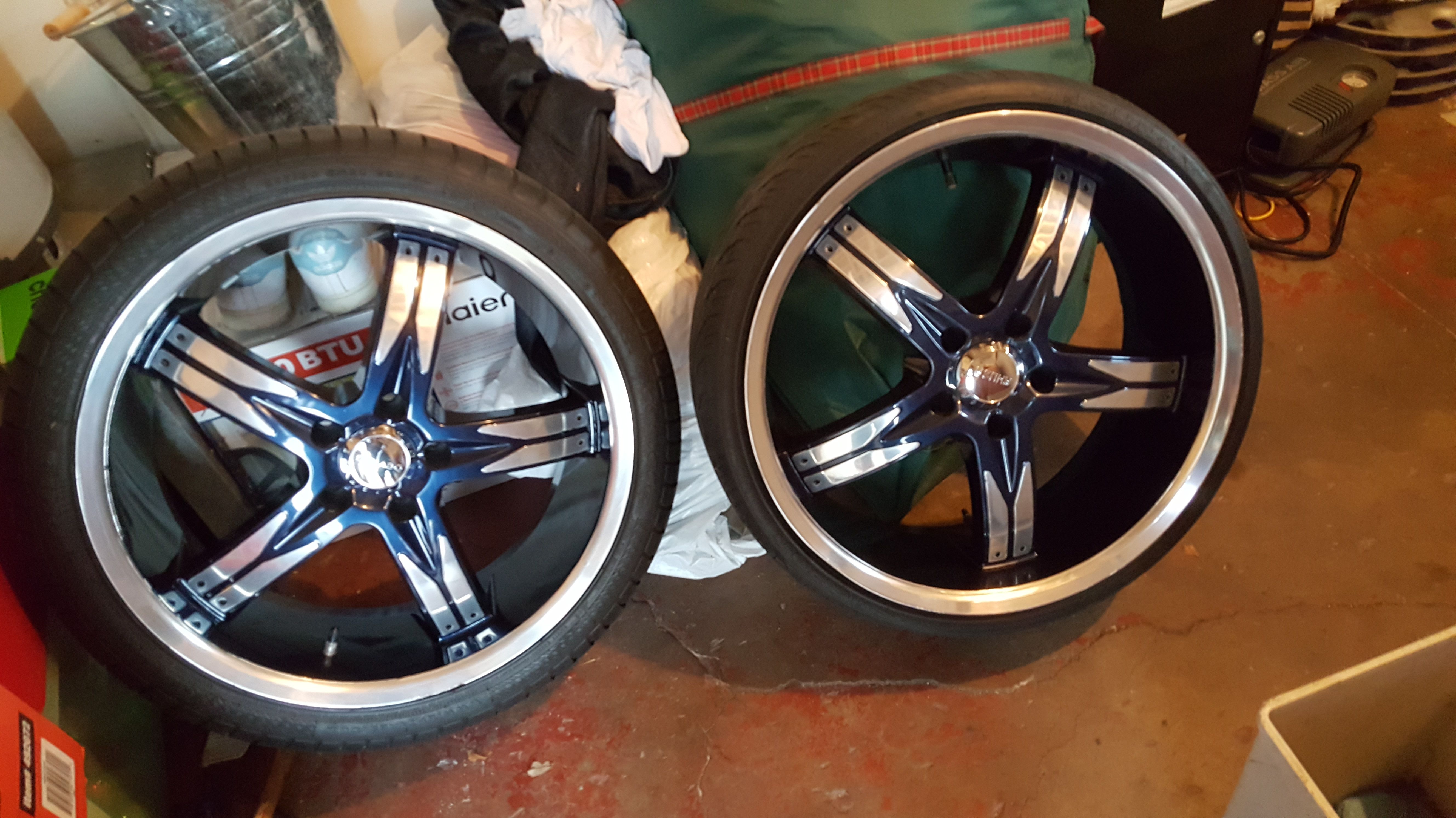 Complete set of custom 20" rims, blue & chrome. Two sets of tires, front used & rear new