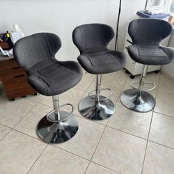 Three gray cloth  and chrome bar stools .. 32 “ at max .., swirl and up and down … $75 each