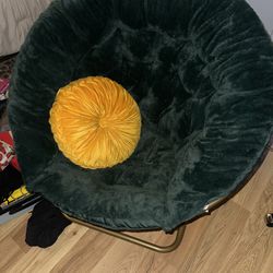 Green Chair With Yellow Pillow