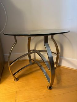 Stainless steel table with beveled glass