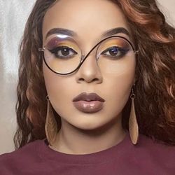 These unique glasses are inspired by Elphaba from Wicked.   Black and gold in color, these round specs are lightweight, and fashionable too!    Not to