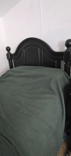 Large Sturdy King-Sized Black Bed.