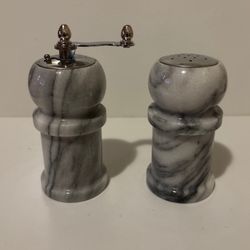 Marble Salt and Pepper Shakers. Pepper is 4.75 inches. Salt is 4 inches.