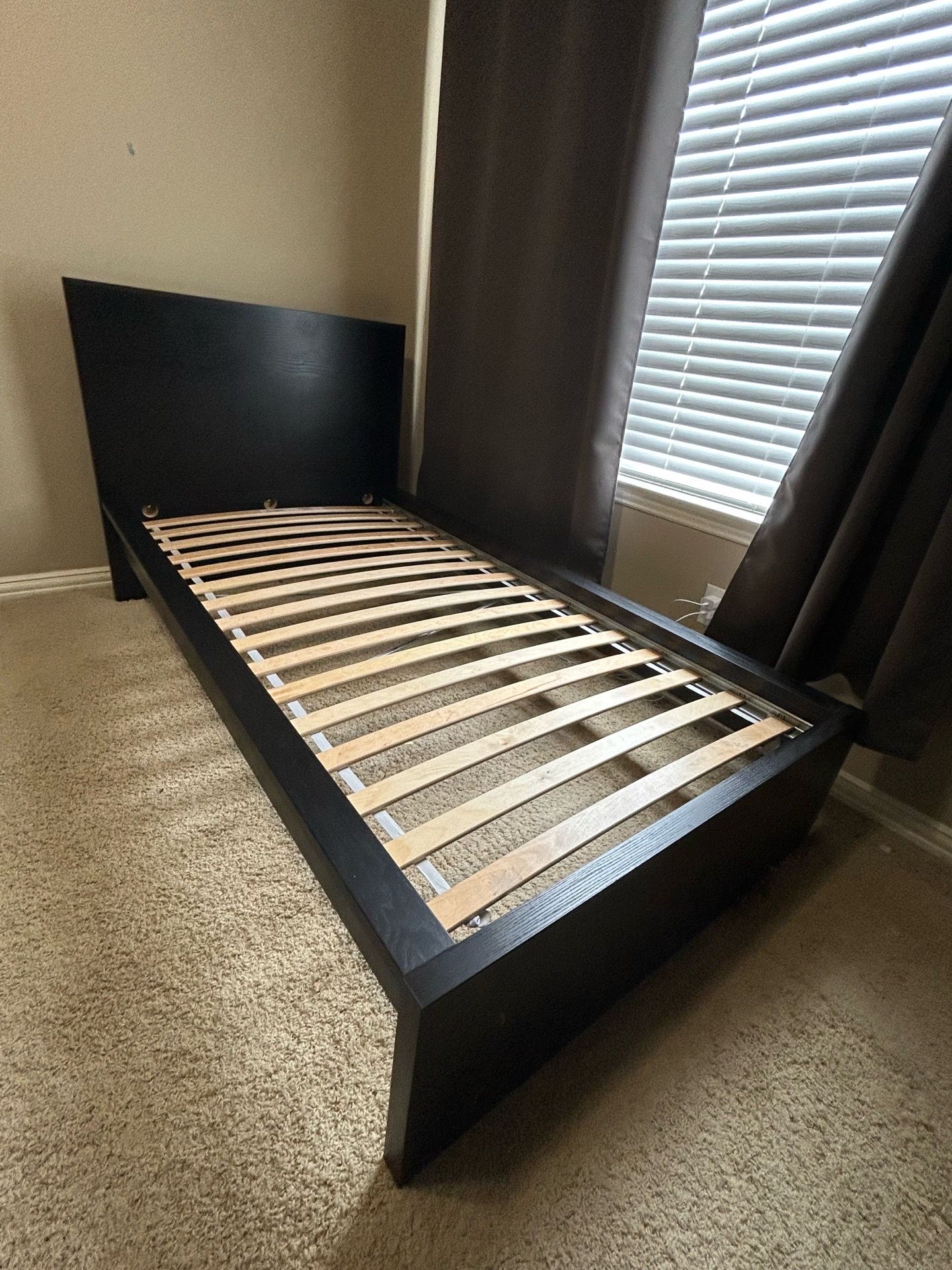 Black twin bed frame with bed slats