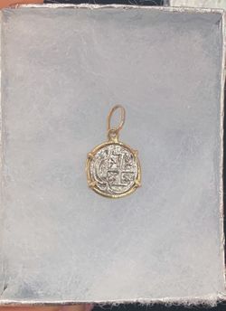 Atocha silver baby coin pendant in gold bezel