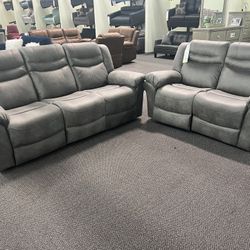 New Power Reclining Couch  / Love Seat .  Grey Breathable Leatherette .  Free Delivery !