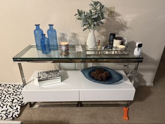 White console table with glass top and chrome frame