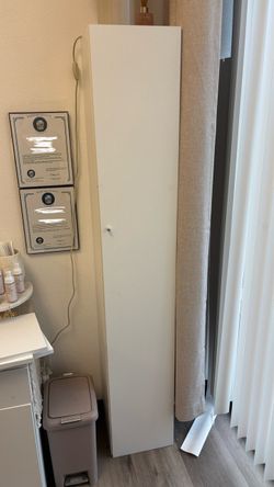 Tall white storage cabinet