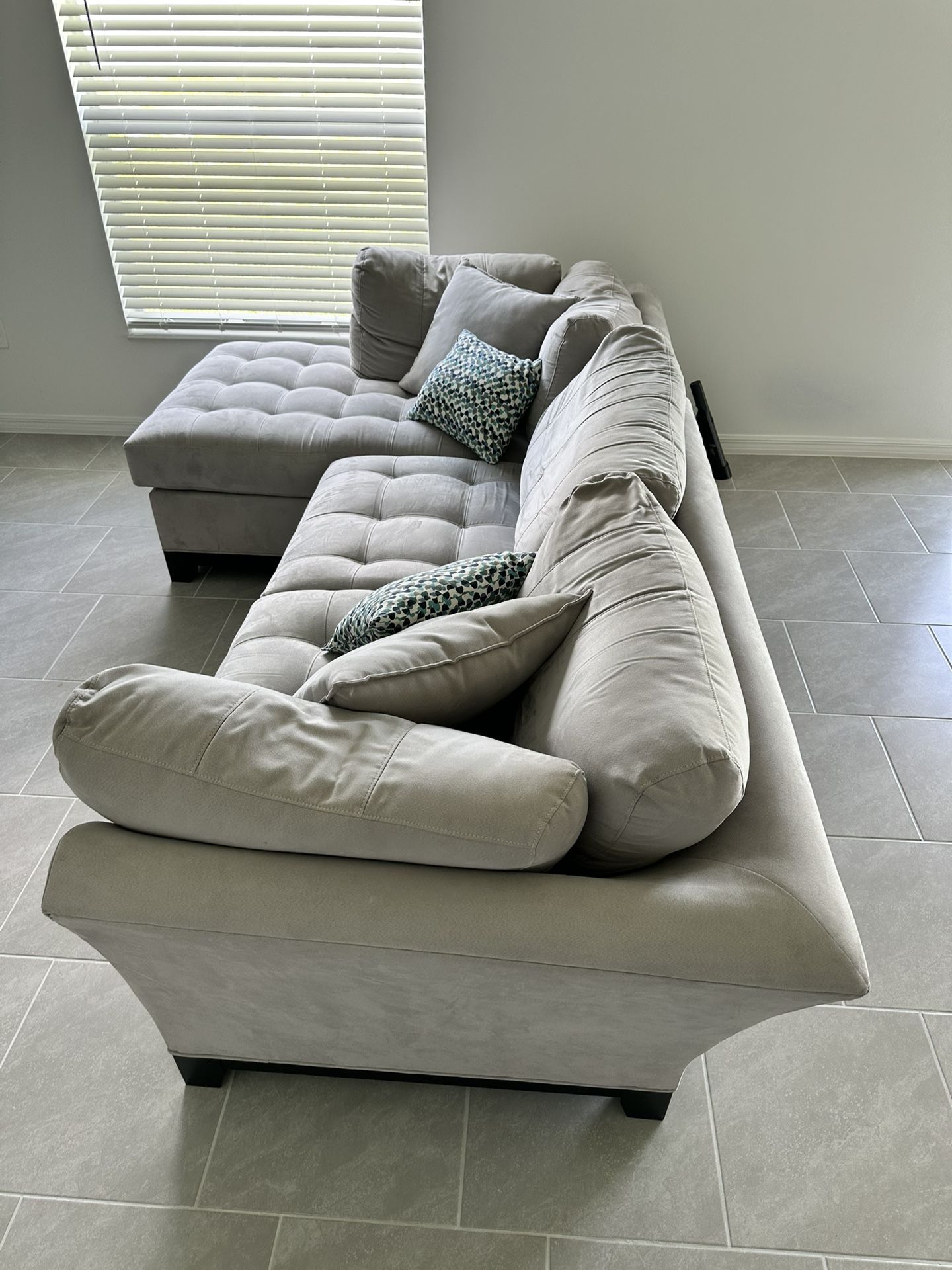 Gray Sofa With Chaise Lounge On Left Side