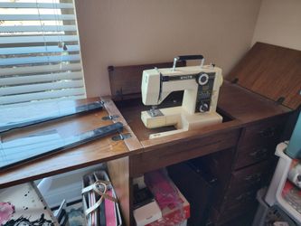 Sewing machine and wood cabinet