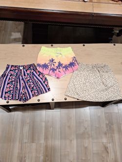 Girls Size 6-7, beige skort, multi color skirt and beach shorts