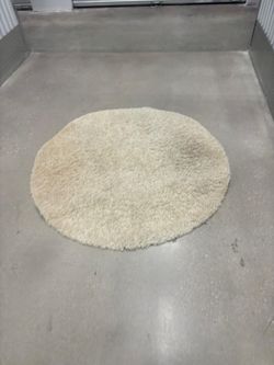48 inches round beige shag rug.. $25