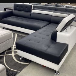 New black and white is the sectional with free delivery