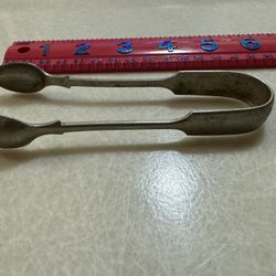 CA. 5” SUGAR CUBE SPOON. HAS HALLMARKS. SEE PICS. 