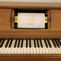 Console Player Piano with Music Rolls
