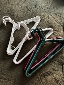 Assortment of 21 plastic hangers