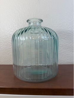 vase is made with recycled glass in a smoked green color