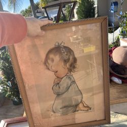 Antique frame with little girl pictures