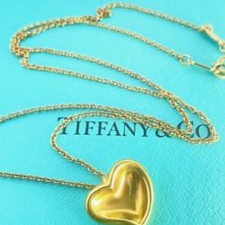 24K solid gold heart. T & Co. signed Perretti