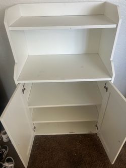 White storage cabinet with shelves