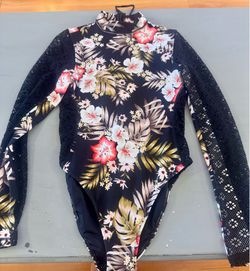 Hurley long sleeve swimsuit. Size L