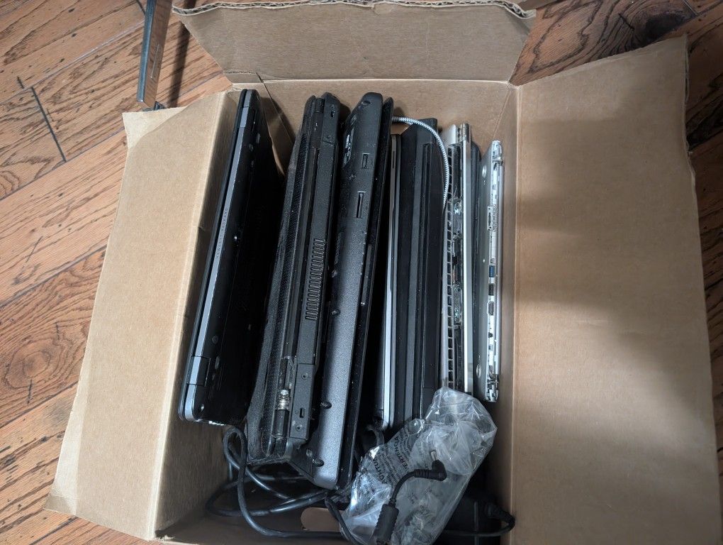 Box Of Laptops And Chargers