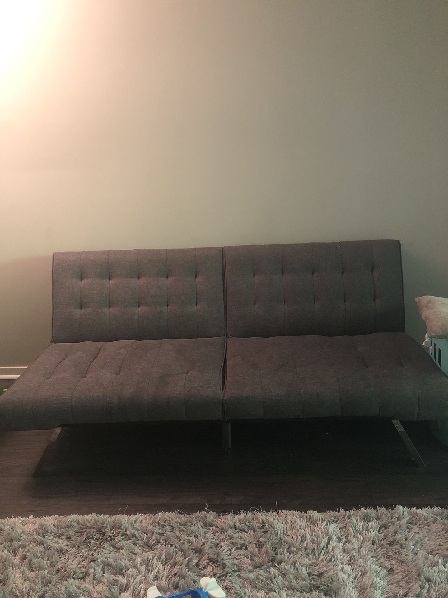Tufted Sofa. Turns in to full size bed