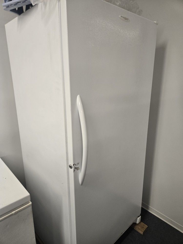 Freezer With Shelves And Holders On Door