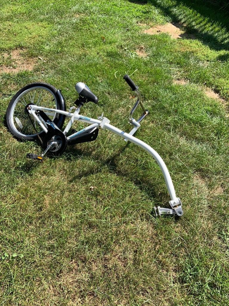 Bike trailer. tag a long type bike for child to ride behind adult