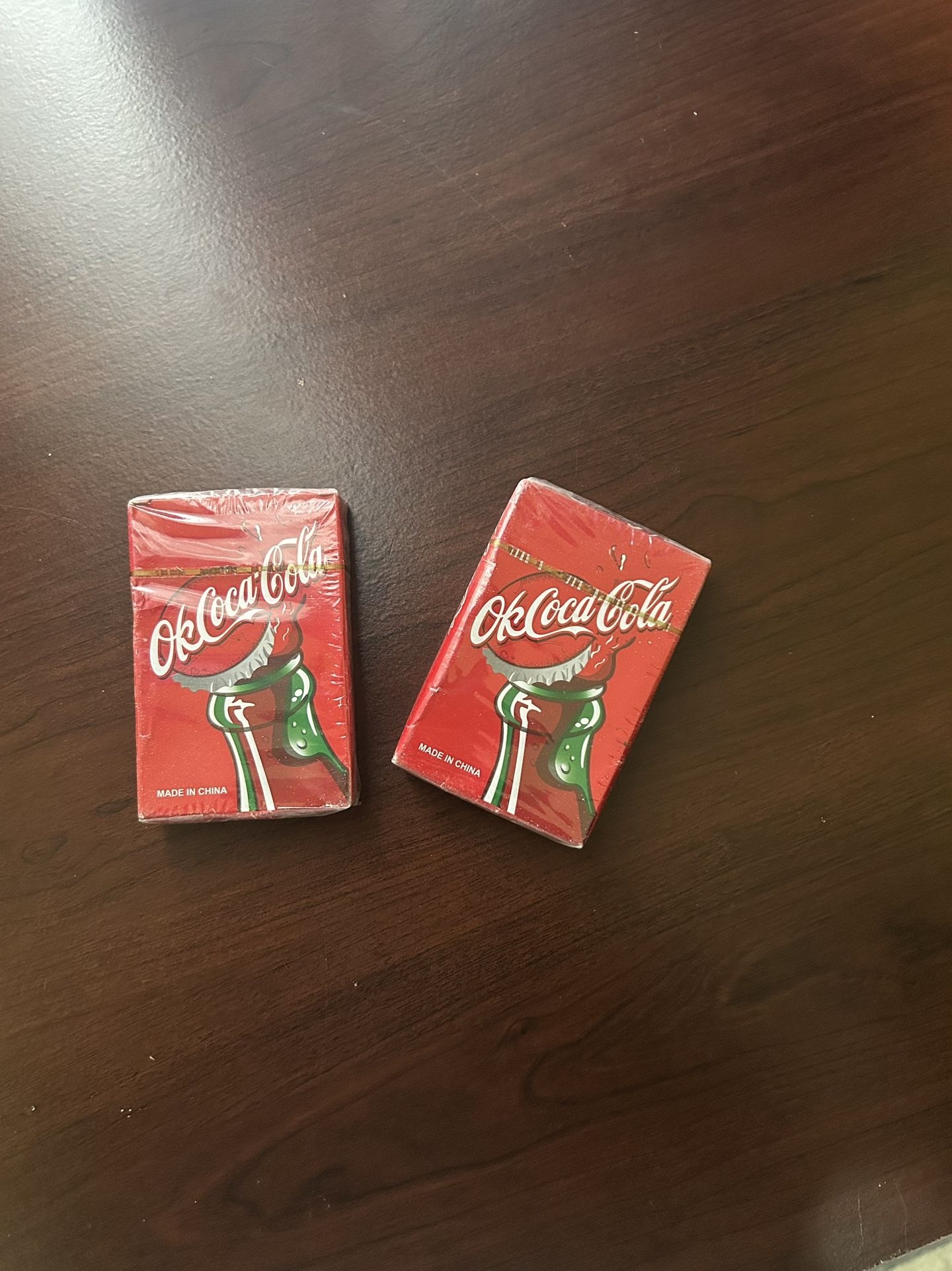 2 Plastic Coated Coca Cola Card Packs