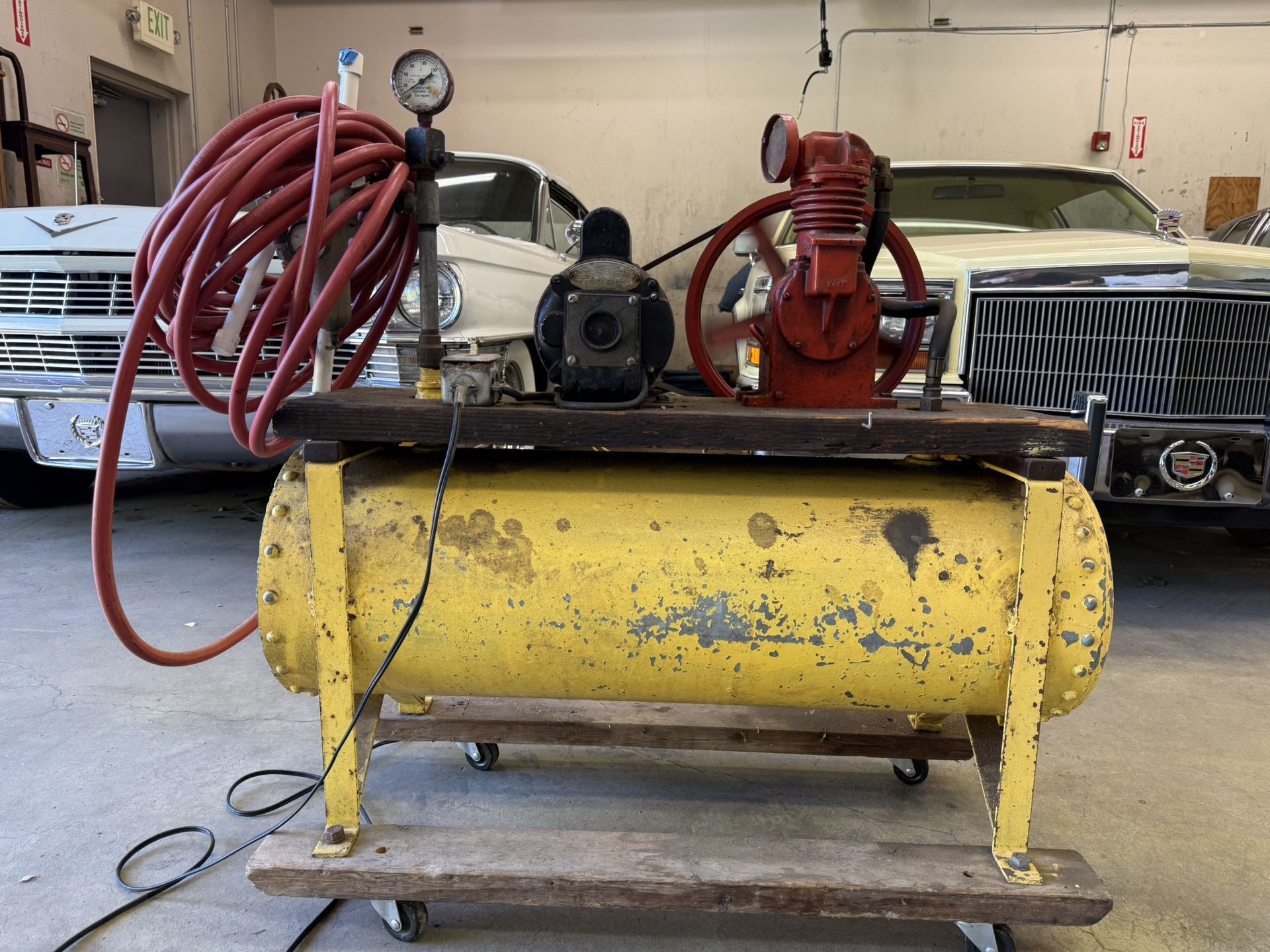 Awesome Antique air compressor tank, pump on wheels. Works great!