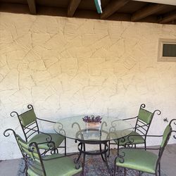 Round glass top table with 4 chairs