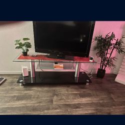 40" Tv, Tv Stand And Roku Stick W/ Remote $45