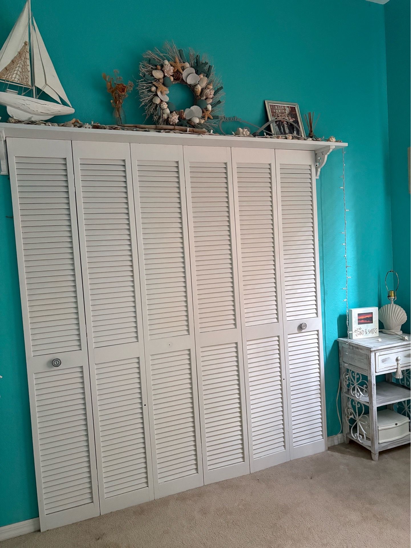 FREE! white DIY’d louver door headboard & top shelf (also selling matching fan in pics)