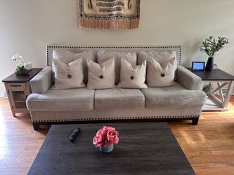 Beige couches with studded trim