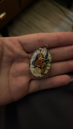 Silver double faced pendent.