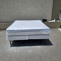 Brand new king-size plush pillow top mattress and box spring in plastics 
