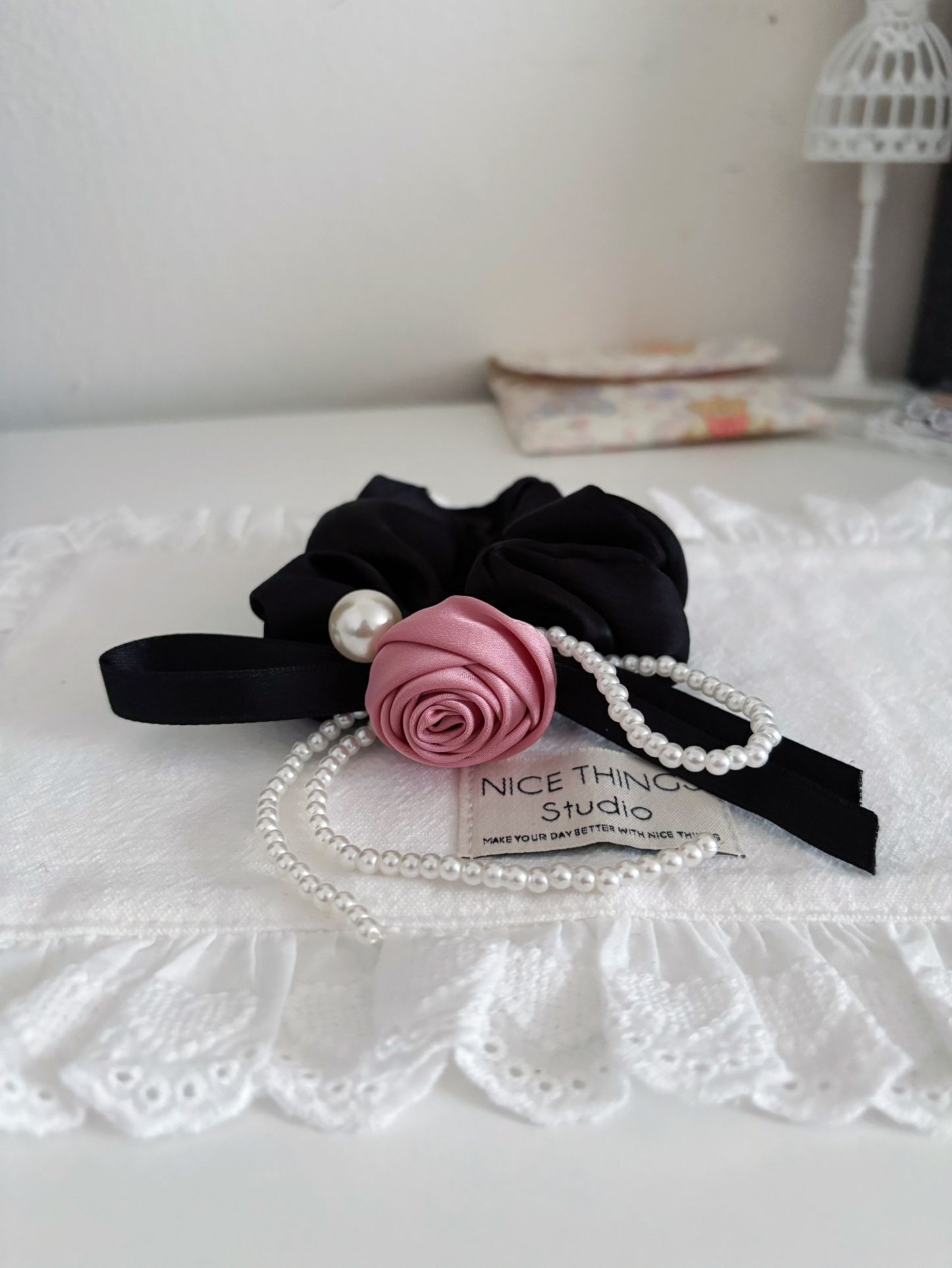 Black color with pink rose and long plastic pearl string scrunchie/hair tie