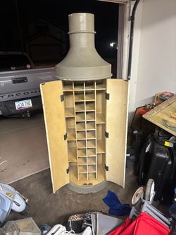 The selected region features a unique, handcrafted wooden wine storage cabinet designed in the striking shape of a giant bottle with built-in interior