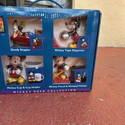 This Mickey Unlimited Desk Collection 4-piece set is a collectible Disneyana item featuring Goofy and Mickey Mouse accessories.
