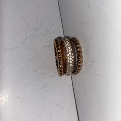 Woman’s gold multi band ring with diamond band
