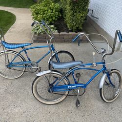 2 blue vintage bikes.Schwinn Stingray Fastback, And RollFast Scoot 3 Speed