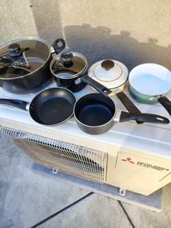 6 PANS 5 GENTLY USED AND THE SOUP PAN IS NEW
